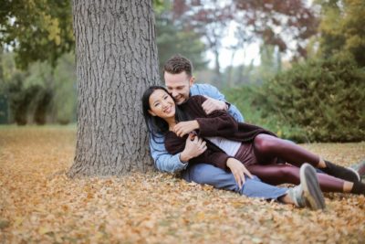 Couple lounging under a tree